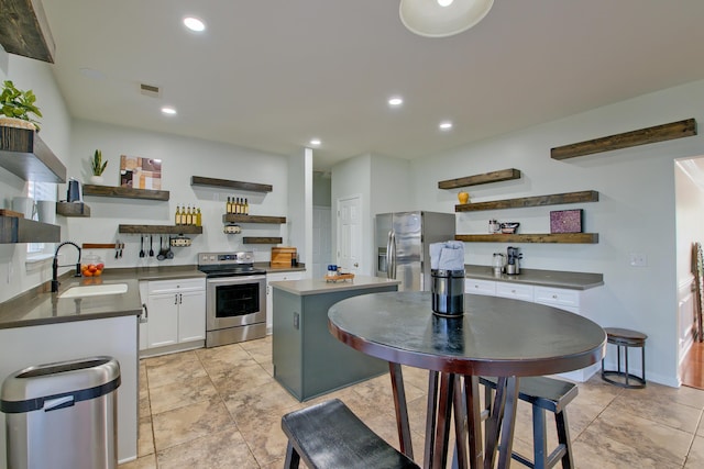 9682 Pebble Creek Blvd, Summerville, SC 29485 - kitchen with open shelves, stainless steel appliances, a sink, white cabinetry, and recessed lighting