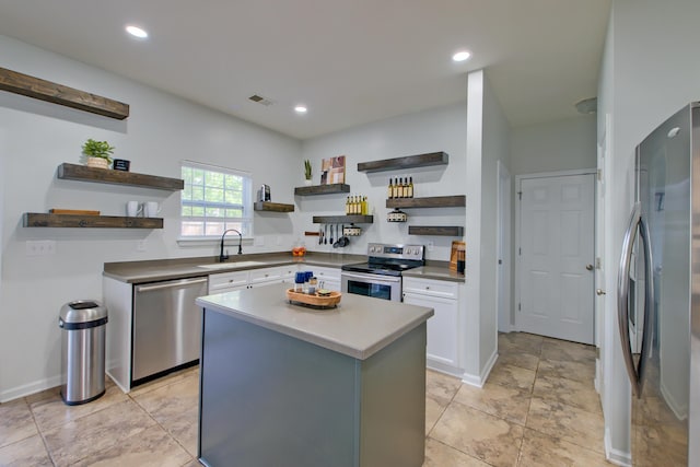 9682 Pebble Creek Blvd, Summerville, SC 29485 - kitchen with open shelves, stainless steel appliances, a sink, white cabinets, and a center island