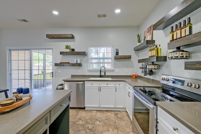 9682 Pebble Creek Blvd, Summerville, SC 29485 - kitchen with open shelves, appliances with stainless steel finishes, a sink, healthy amount of natural light, and recessed lighting