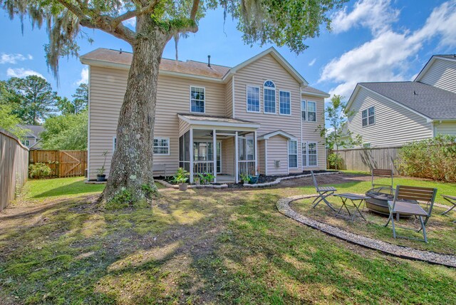 9682 Pebble Creek Blvd, Summerville, SC 29485 - view of front of house featuring a sunroom and a fire pit