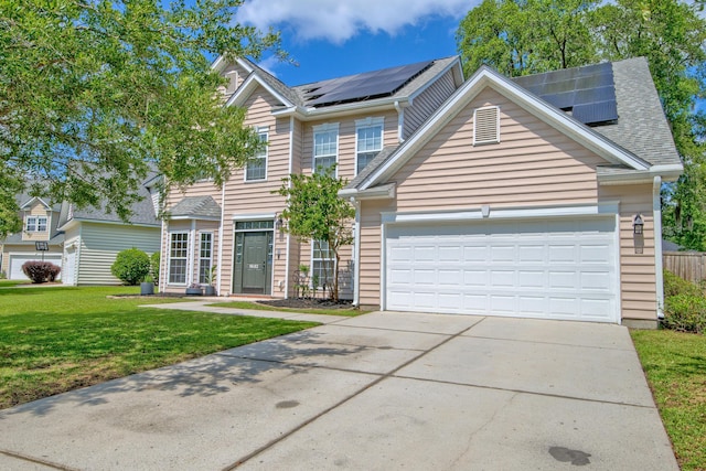 9682 Pebble Creek Blvd, Summerville, SC 29485 - traditional-style house with solar panels, a front yard, driveway, a garage, and a shingled roof
