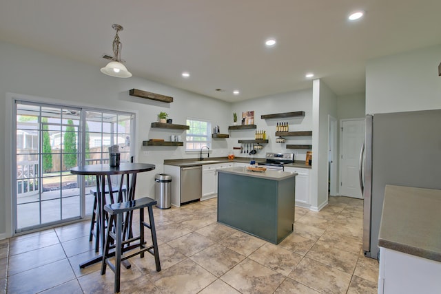 9682 Pebble Creek Blvd, Summerville, SC 29485 - kitchen featuring open shelves, stainless steel appliances, white cabinets, a center island, and decorative light fixtures
