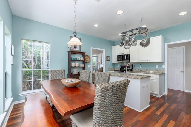 dining area with recessed lighting, baseboards, and dark wood finished floors