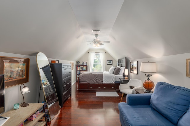 bedroom with wood-type flooring, a ceiling fan, visible vents, and vaulted ceiling