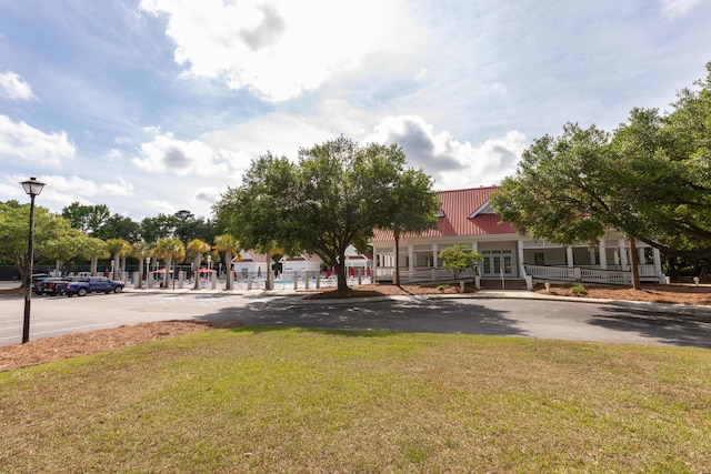 view of community featuring a lawn