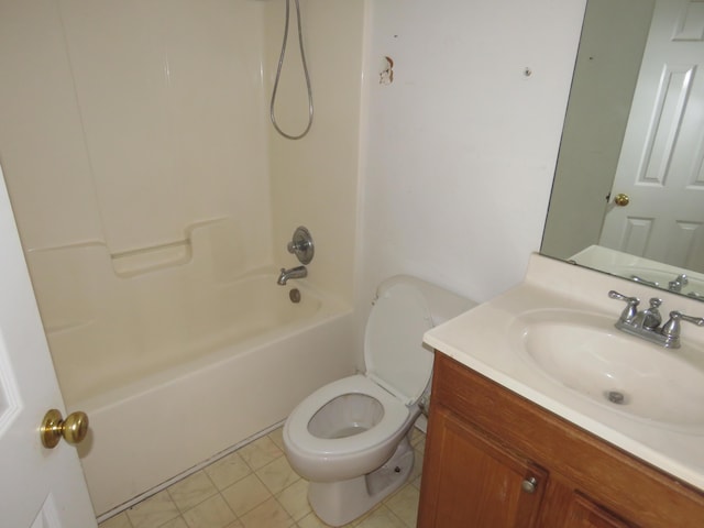 bathroom featuring toilet, vanity, and shower / bathtub combination