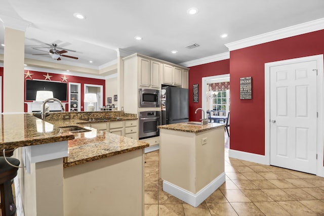 kitchen featuring a ceiling fan, a sink, black appliances, a peninsula, and ornamental molding