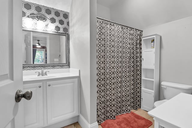 bathroom with vanity, tile patterned floors, curtained shower, and toilet