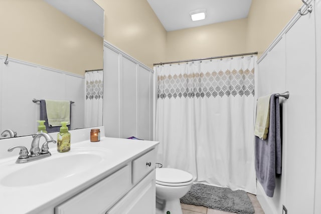 bathroom with vanity, tile patterned floors, toilet, and a shower with curtain