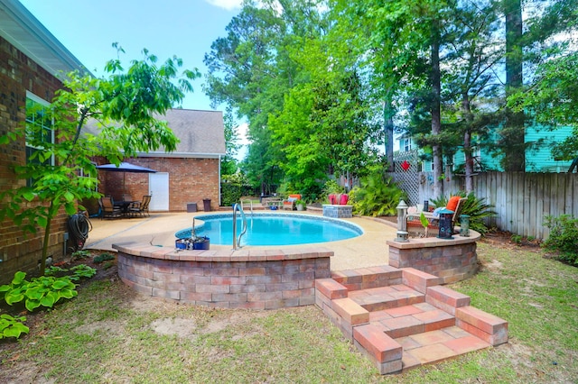 view of swimming pool with a patio, a fenced backyard, and a fenced in pool