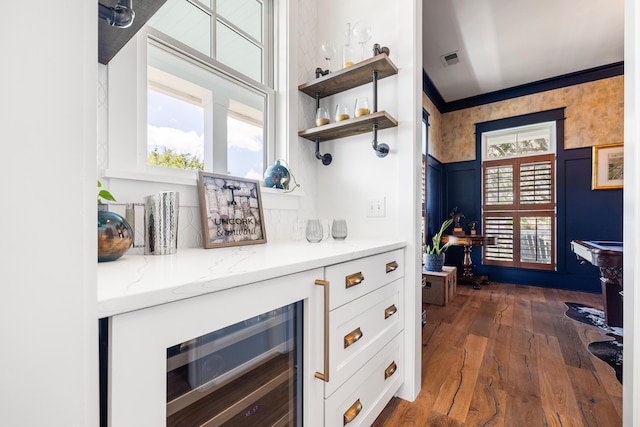 566 Wading Pl, Daniel Island, SC 29492 - indoor dry bar with wine cooler and dark wood-type flooring