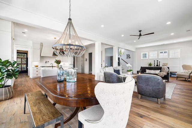 566 Wading Pl, Daniel Island, SC 29492 - dining area featuring stairs, recessed lighting, ceiling fan, light wood-type flooring, and ornamental molding