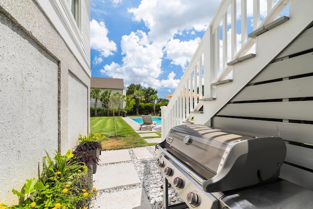 566 Wading Pl, Daniel Island, SC 29492 - view of patio with stairway, area for grilling, and an outdoor pool