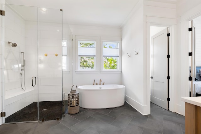 566 Wading Pl, Daniel Island, SC 29492 - full bath with a shower stall, a soaking tub, and tile patterned flooring