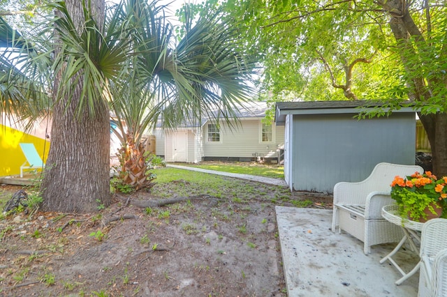 1159 Camden St, North Charleston, SC 29405 - view of yard with a patio, a shed, and an outbuilding