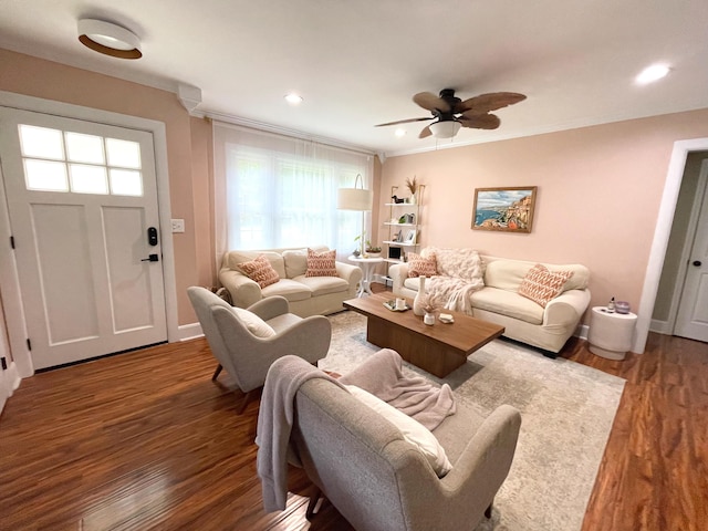 living room with ceiling fan, ornamental molding, recessed lighting, and wood finished floors