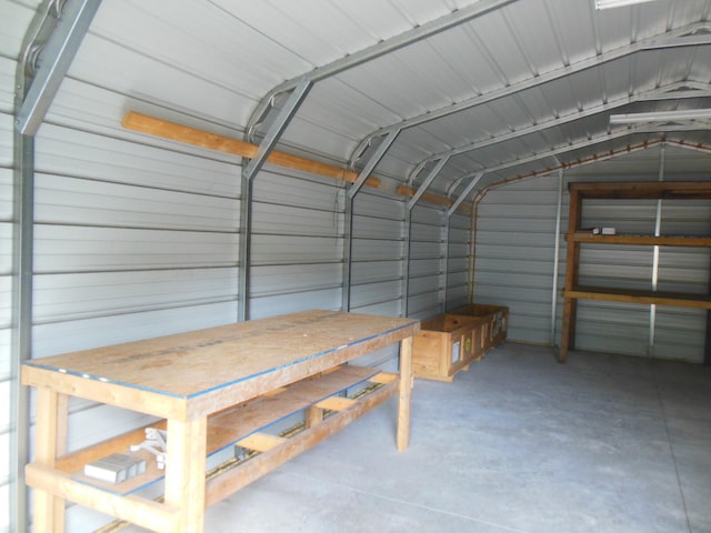 garage featuring wood walls