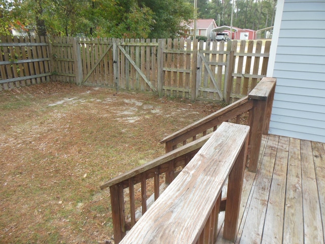 view of yard with a wooden deck