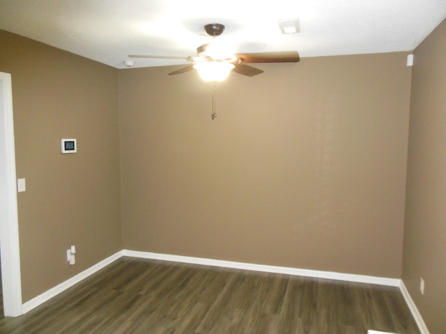 unfurnished room with ceiling fan and dark hardwood / wood-style flooring