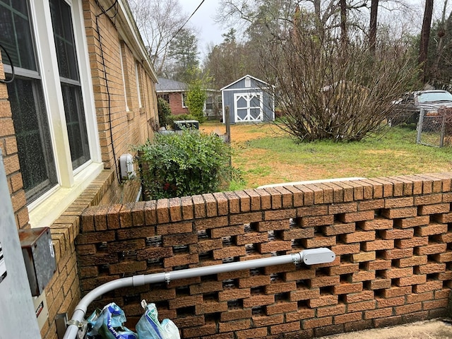 exterior space with a storage shed