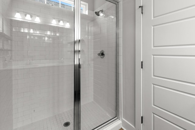 full bath with a shower stall