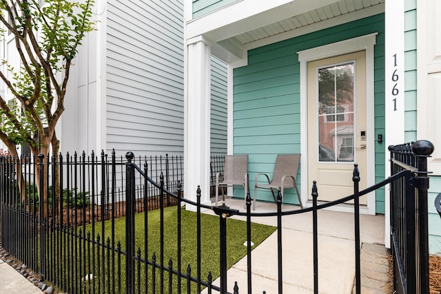 doorway to property featuring covered porch