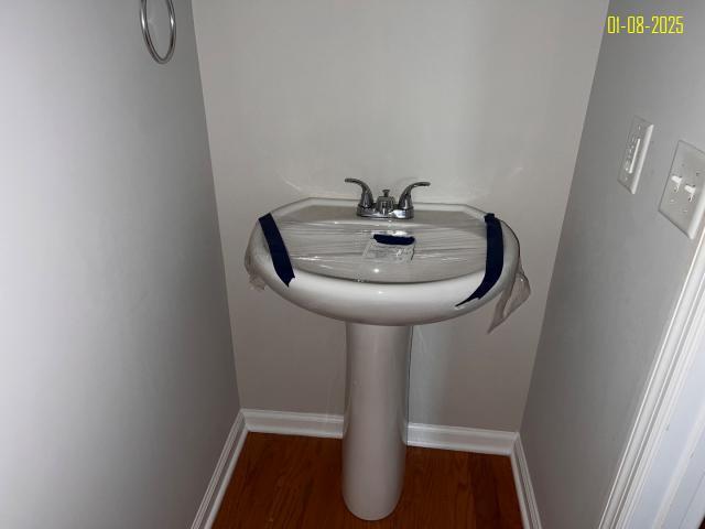 bathroom featuring hardwood / wood-style floors and sink