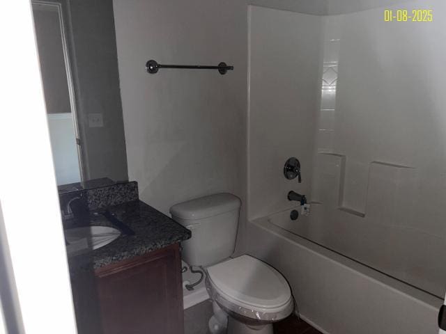 full bathroom with washtub / shower combination, vanity, and toilet