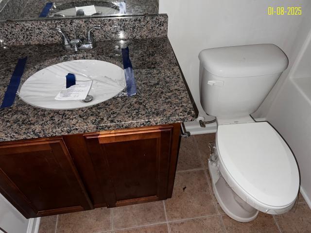 bathroom with vanity and toilet