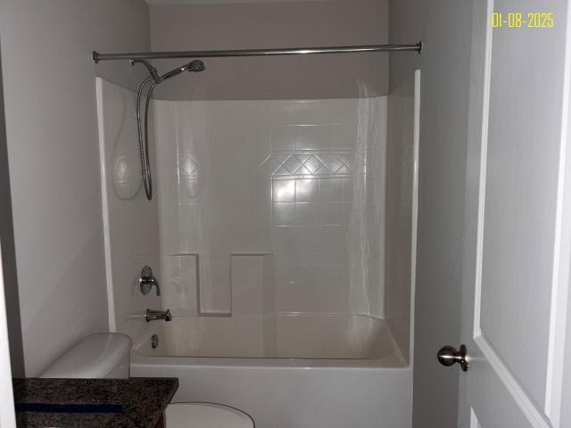 full bathroom featuring vanity, toilet, and bathtub / shower combination