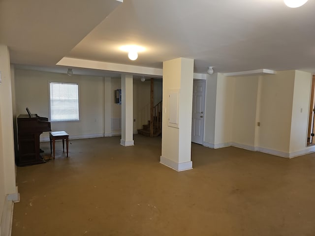 below grade area with baseboards and stairs