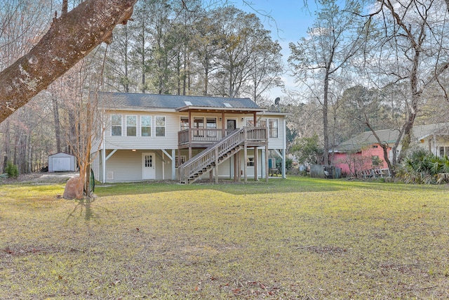back of property featuring a storage shed, a lawn, stairs, a wooden deck, and an outdoor structure