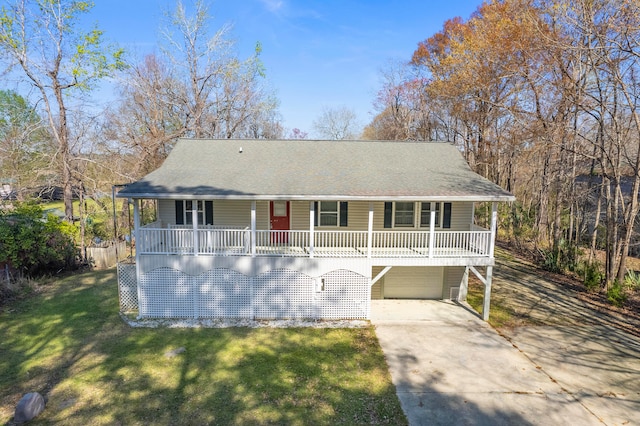 view of front of home with covered porch, a garage, a shingled roof, concrete driveway, and a front lawn