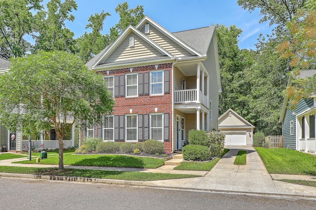 1408 Bimini Dr, Charleston, SC 29414 - view of front facade with a balcony, brick siding, an outbuilding, and a detached garage