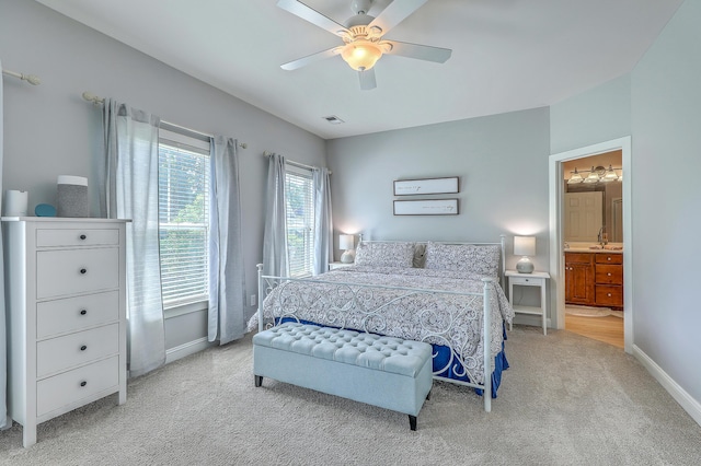 1408 Bimini Dr, Charleston, SC 29414 - bedroom featuring light colored carpet, baseboards, a ceiling fan, and connected bathroom