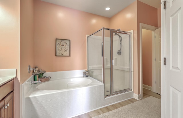 1408 Bimini Dr, Charleston, SC 29414 - bathroom with a shower stall, a bath, vanity, and wood finished floors