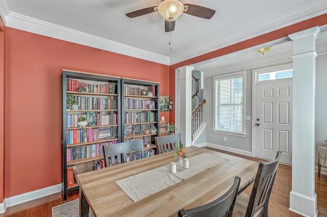 1408 Bimini Dr, Charleston, SC 29414 - dining room with decorative columns, baseboards, a ceiling fan, crown molding, and wood finished floors