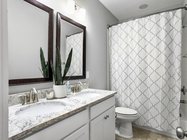 full bathroom featuring tile patterned flooring, vanity, shower / tub combo, and toilet