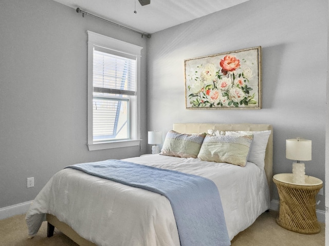 bedroom with ceiling fan and carpet floors