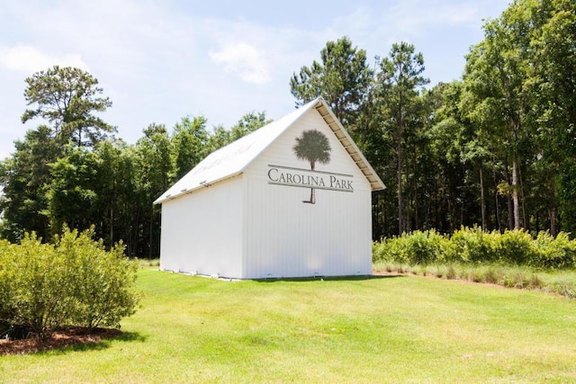 view of outdoor structure with a lawn