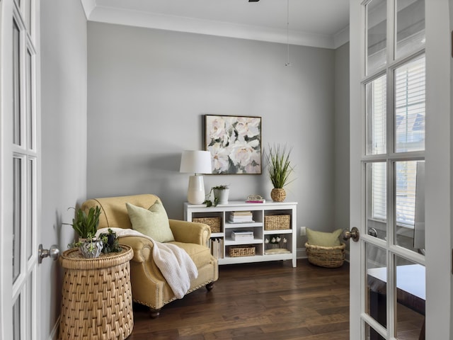 living area with ornamental molding, dark hardwood / wood-style flooring, and french doors