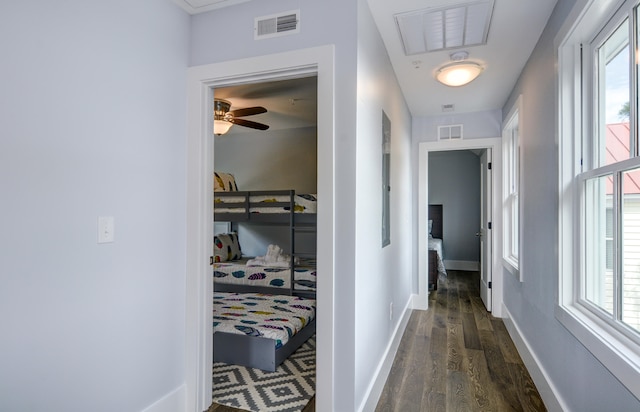 corridor featuring dark hardwood / wood-style floors