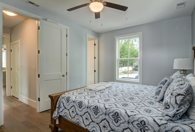 bedroom with wood-type flooring and ceiling fan