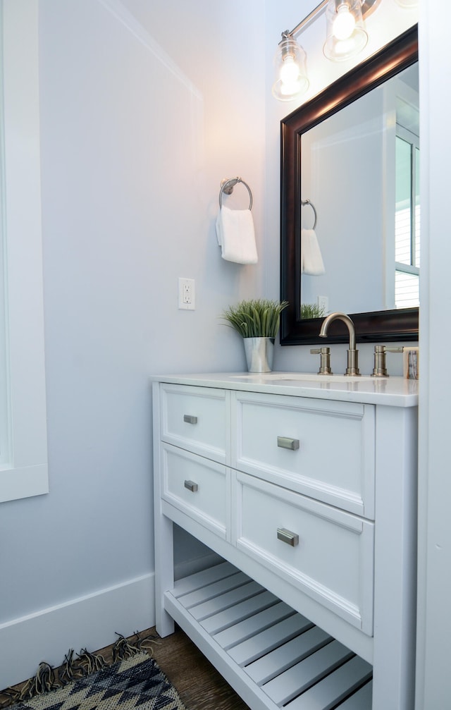 bathroom with vanity and hardwood / wood-style floors