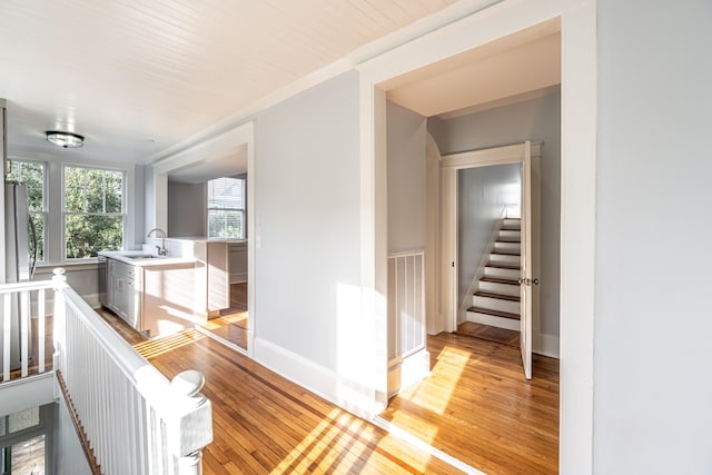 hallway featuring light hardwood / wood-style floors and sink