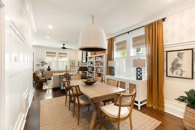 1012 Ashley Ave, Charleston, SC 29403 - dining room featuring dark wood finished floors, a ceiling fan, a decorative wall, crown molding, and baseboards