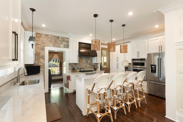 1012 Ashley Ave, Charleston, SC 29403 - kitchen with a center island, a sink, range hood, crown molding, and appliances with stainless steel finishes