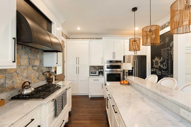 1012 Ashley Ave, Charleston, SC 29403 - kitchen featuring white cabinets, extractor fan, decorative backsplash, crown molding, and appliances with stainless steel finishes