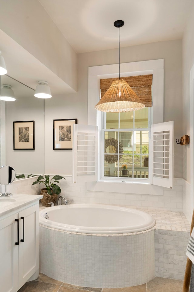 1012 Ashley Ave, Charleston, SC 29403 - bathroom featuring a garden tub, tile patterned floors, and vanity