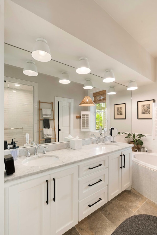 1012 Ashley Ave, Charleston, SC 29403 - bathroom with a tile shower, a garden tub, a sink, and double vanity